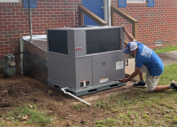 Man installing AC unit